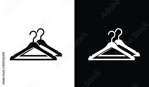 A striking visual composition showcases two sets of black clothing hangers against contrasting backgrounds one white and one black creating duality high quality