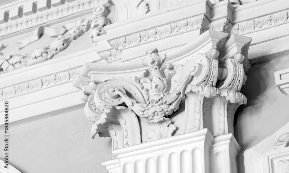 Obraz premium Intricately designed baroque ornamentation carving on a white wall