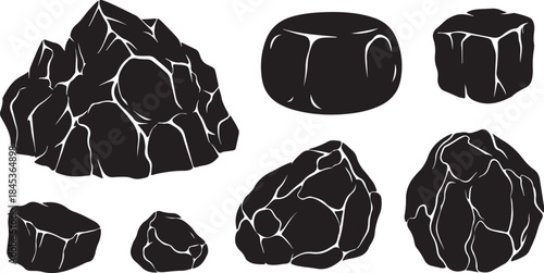 Set of black coal lumps isolated on white