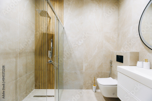 Contemporary restroom featuring sleek fixtures and calming accents