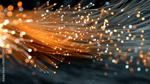 Abstract colorful light trails with glowing particles on dark background for creative use