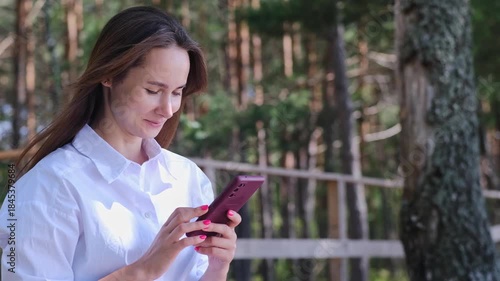 Phone, search and woman at a beach with social media, chat or web communication in nature. Travel and face of female person at sea with smartphone app for location, map or taxi service request