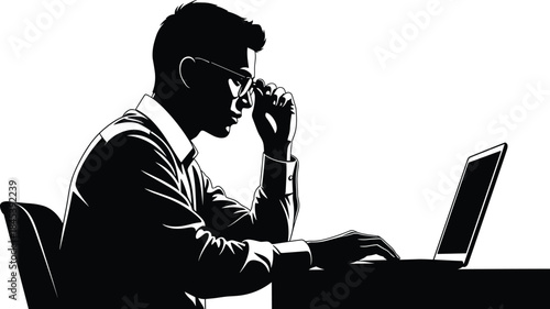 Focused young businessman silhouette working seriously on laptop computer, wearing eyeglasses, concept of concentration, IT professional, or student