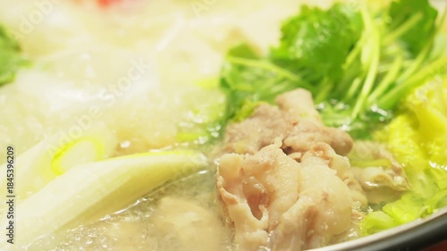 Hot pot filled with grated daikon radish, vegetables, meat, crab, and more—a winter gourmet delight