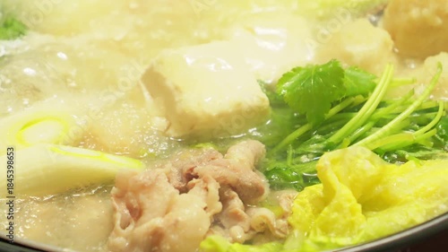 Hot pot filled with grated daikon radish, vegetables, meat, crab, and more—a winter gourmet delight
