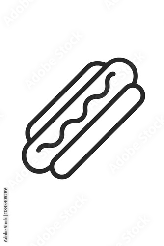 Classic hot dog sandwich served in a bun and topped with a wavy line of mustard or ketchup sauce