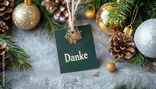 Paper tag with german word thank you on christmas background