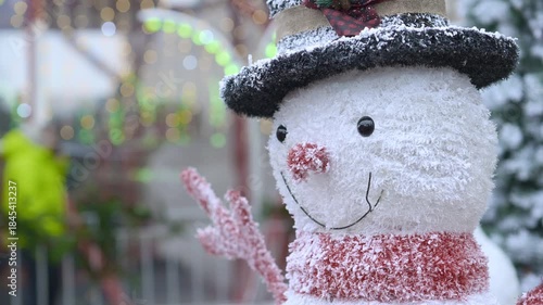 Snowman Figure Against Blurred Holiday Lights
