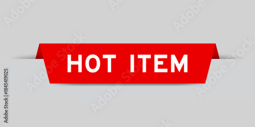 Red color inserted label with word hot item on gray background