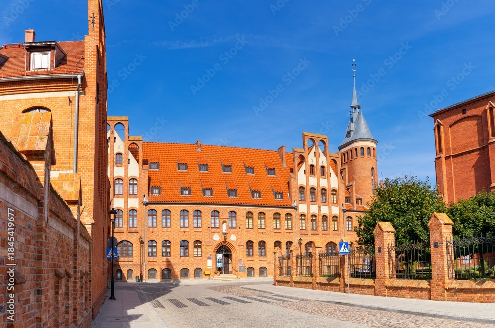 Obraz premium view of the red brick Gothic Convent of the Sisters of Charity in downtown Chelmno