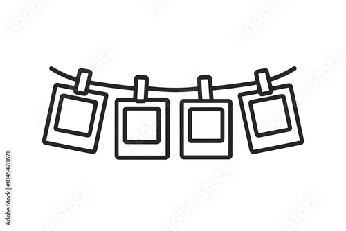 Four instant photo frames hanging on a clothesline with small clips for memory display