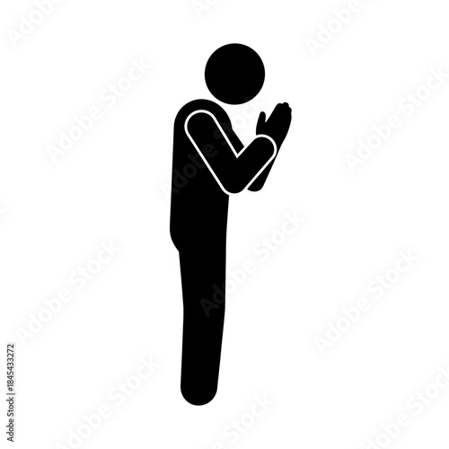 Silhouette of a person praying with hands clasped together.