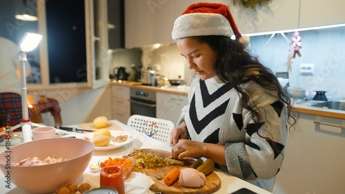 Woman diligently creating festive recipes at kitchen table today