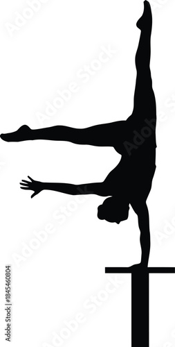 Silhouette of a female gymnast performing a handstand on a balance beam