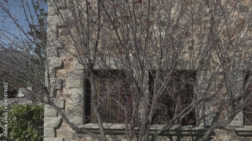 Tree branches old stone house Polecam jib windows down 3