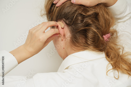 Woman with  a BTE hearing aid