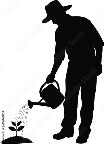 Farmer nurturing young plant with watering can