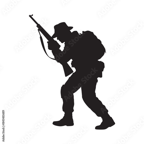 Silhouette of a hunter carrying a rifle and wearing a backpack outdoors