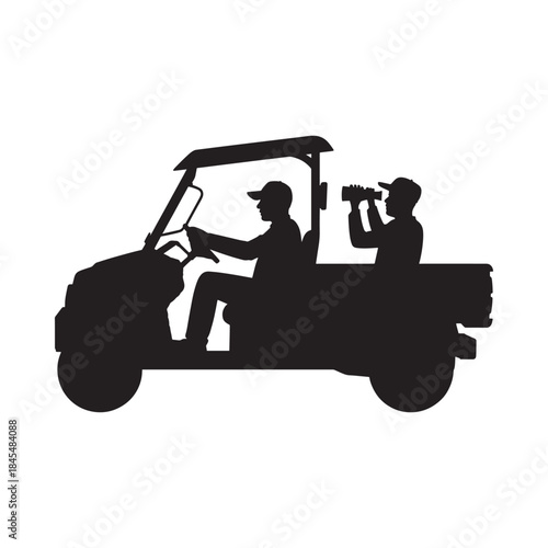 Silhouetted image of two people riding in an open utility vehicle