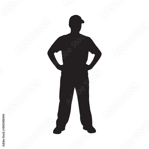 A silhouetted figure of a man standing with hands on his hips