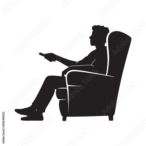 A silhouette of a man relaxing in an armchair watching television