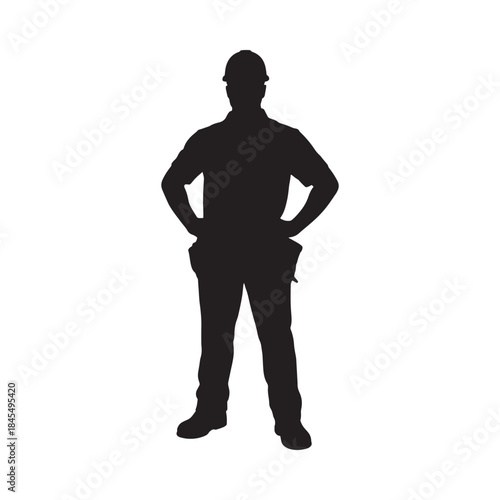 Silhouette of a construction worker standing with hands on hips