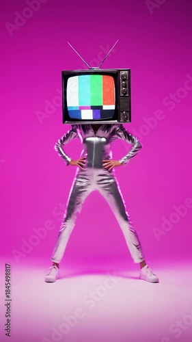 Person With Tv Head Standing in Shiny Suit on Pink Background