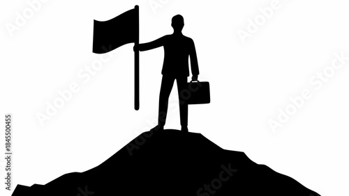 Confident businessman standing on mountain peak with flag