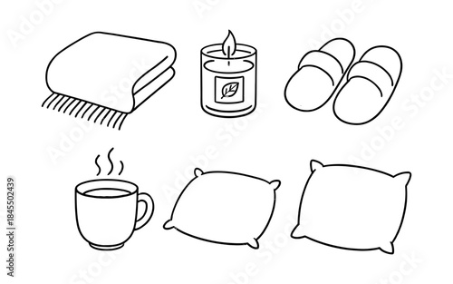 Cozy home comfort items including a blanket, candle, slippers, and hot drink