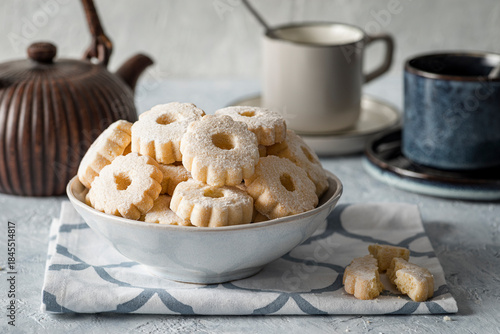 Cookies arranged in a bowl, ready to accompany tea time.
