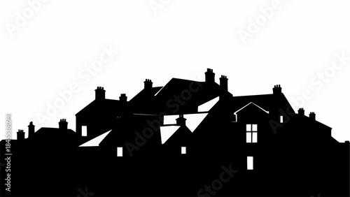 Silhouette of a cluster of houses with glowing windows at night.