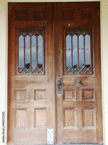 old wooden doors with decorative windows