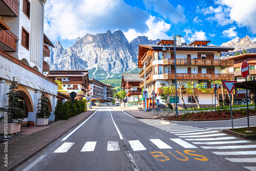 Alpine town of Cortina D Ampezzo street and Alps peaks view