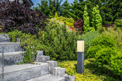 Foto Garden Steps Lead to Plants and a Light Fixture