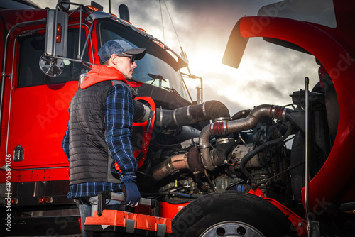 Canvastavla Mechanic Works on Truck Engine During Sunny Day