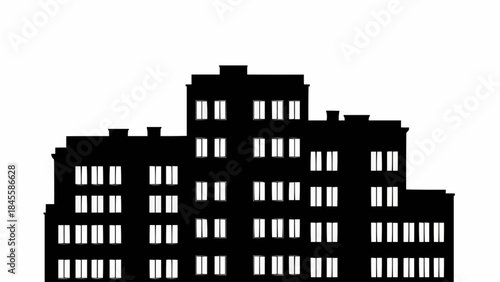 Silhouette of a large apartment building with many windows.