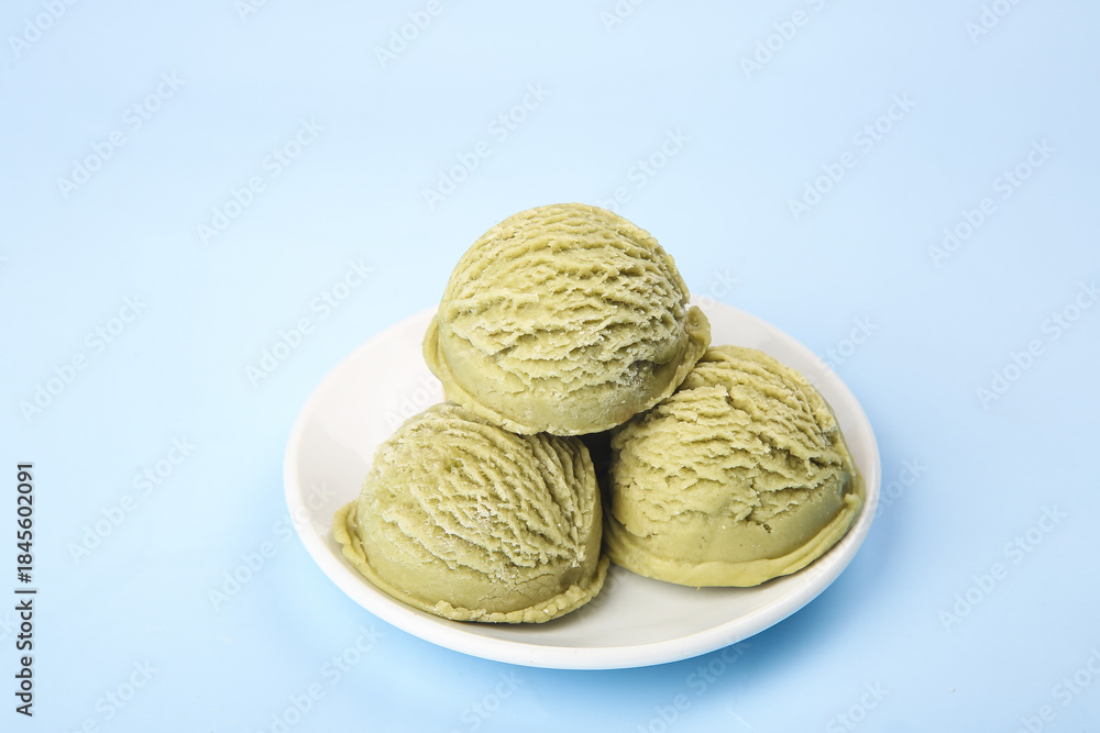 Fototapeta premium Matcha Green Tea Ice Cream Scoops on White Plate