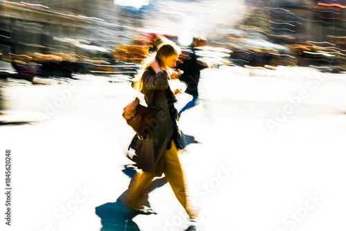 Postmodernism style, artistic motion of people with shopping bags crossing Oxford Circus junction at sunny day. London