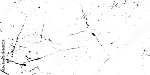 Abstract texture with dark cracks and spots on a white background