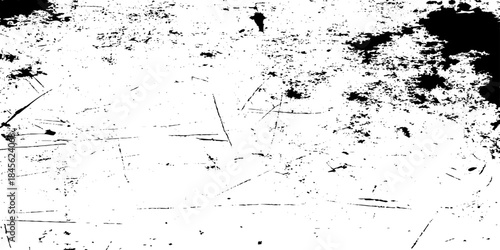Abstract black and white texture with scattered shapes and grainy details