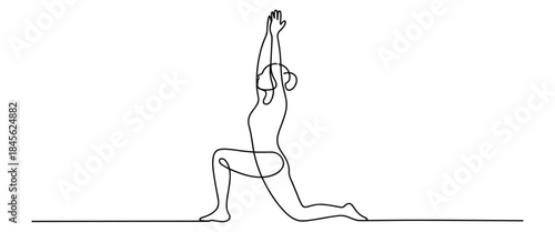 Woman in yoga pose with arms raised up in air