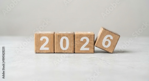 Wooden blocks forming the year 2026 on a light background, representing future plans and new beginnings.