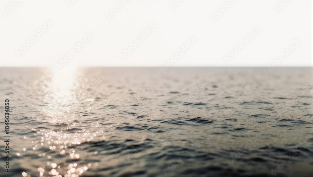 Fototapeta premium Sunlight reflecting on the oceans surface, creating a shimmering effect.