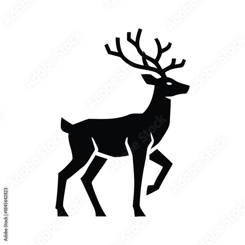 Silhouette of a majestic stag with impressive antlers in a walking pose