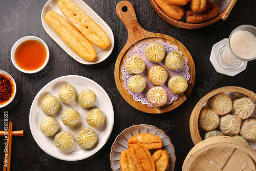 Foto Asian Breakfast Spread with Dumplings, Bread and Condiments