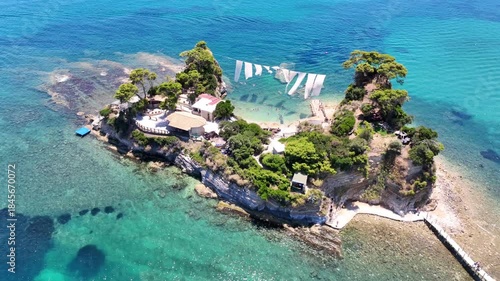 Aerial drone cinematic video of scenic small islet and sandy beach of Cameo in bay of Laganas, Zakinthos island, Ionian, Greece