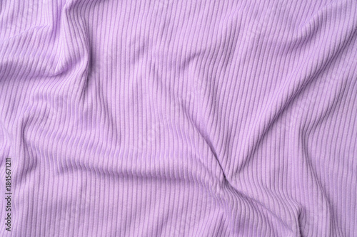 Purple fold knitted fabric background and texture.The fabric features a prominent vertical rib texture.