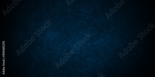 Dark Blue background with grunge backdrop texture, watercolor painted mottled blue background, colorful bright ink and watercolor textures on black paper background.