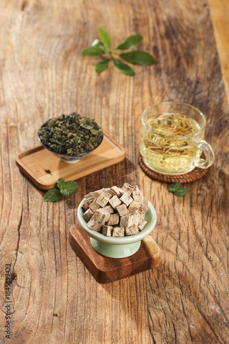 Wild Kudzu Root Tubers and Herbal Medicine Tea on Wooden Background for Natural Health Formula