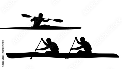 Silhouettes of kayakers paddling in water